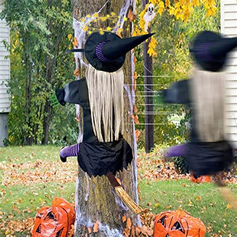 Halloween witch crashing into tree